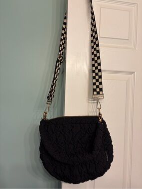 Black Quilted Crossbody Bag with Checkerboard Strap from Modern Chic